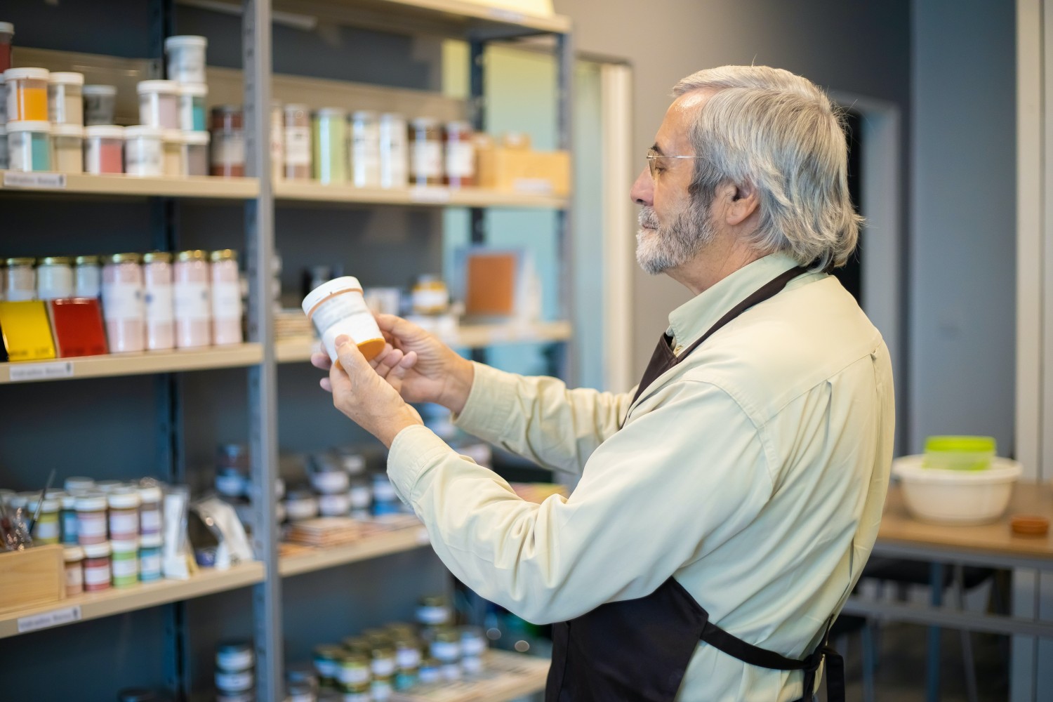 The Role of a Pharmacy Technician at an Online Pharmacy 1 A man holding a white medication bottle